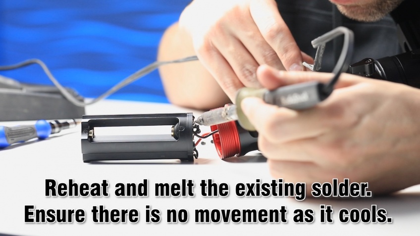 Reheat and melt the existing solder. Ensure there is no movement