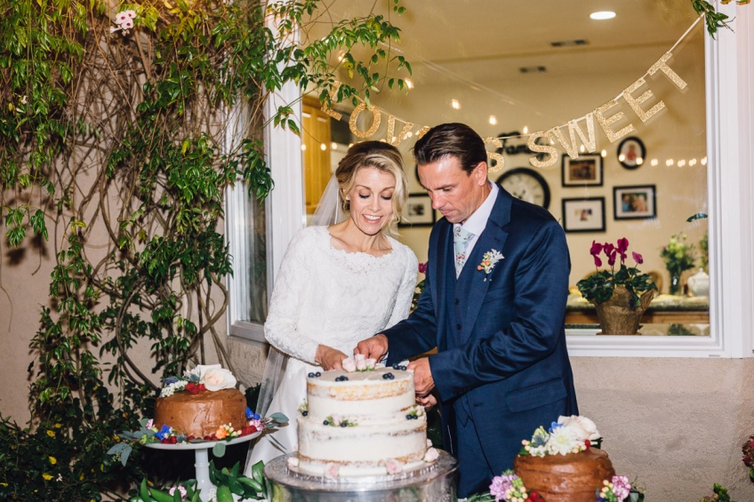 Bride and Groom Cutting Cake